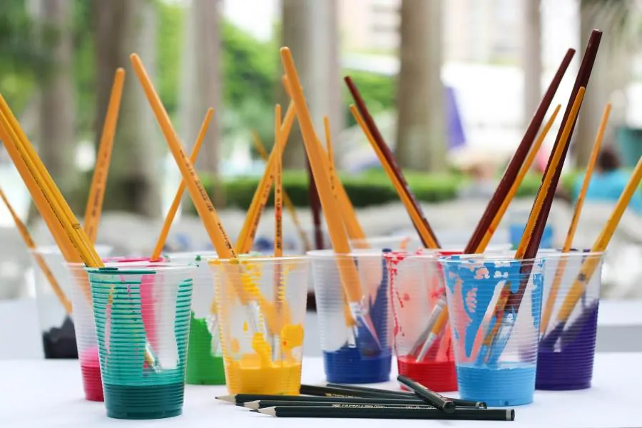 Paint Brushes in Cups of Paint Large